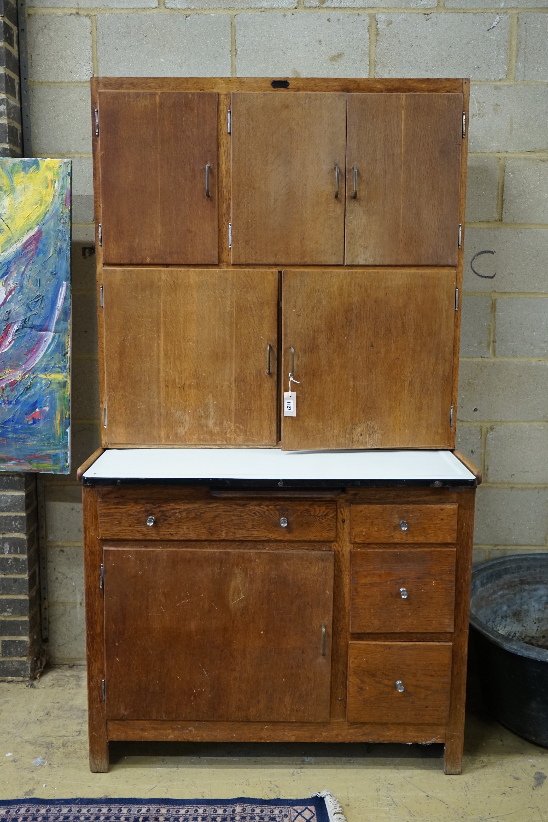 An early 20th century oak 'Easiwork' enamel top kitchen cabinet Streamline Deluxe model, length 110cm, depth 64cm, height 198cm